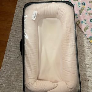 Dock a tot Deluxe. Strawberry crème color.